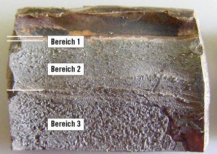 Bild 6: Bruchfläche mit charakteristischen Bereichen

