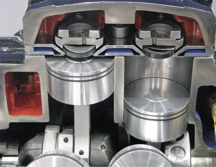 Der Ventil- und Ventilplattenaufbau des Streamline-Verdichters mit dem Kunststoff-Druckventil in der Mitte